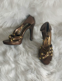 Elevate Your Look with Bronze Heels featuring Golden Stud Detail