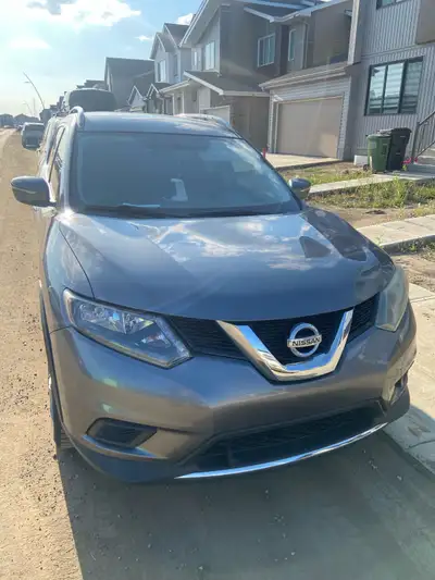 This 2014 Nissan Rogue is a reliable SUV that is in used condition, notably featuring a dent on the...
