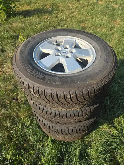 4 P235/70R16 winter tires, 2 michelin x-ice with 8/32nds and 2 Firestone winterforce with 10/32nds....