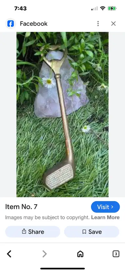 Vintage brass golf club bottle opener. It's a novelty item that is shaped like a golf club and has a...
