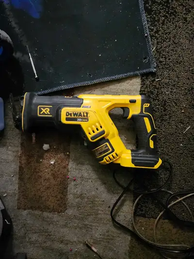 This DeWalt 20V Max XR reciprocating saw is a powerful, reliable tool in good condition, ready to ta...