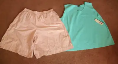 The turquoise top is brand new with tags still on. It is by Attitude and is a size 2X. There is a lo...