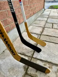 3 hockey sticks, 2 adult lefties includes a brand new $125 Bauer