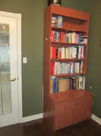This is Custom Made Bookcase  with  Lots of  Adjustable  Shelves
