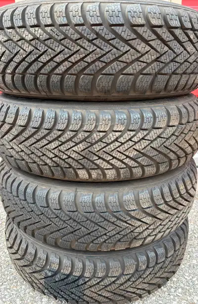 BRAND NEW CON 4 x 165/65/14 PIRELLI WINTER TIRES $450 (NO RIMS) CAME OFF MITSUBISHI MIRAGE 100% TREA...