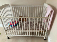 Baby crib, one side folds down