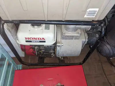 This is a used Honda WB30X water pump, ready to tackle your de-watering challenges with its robust p...