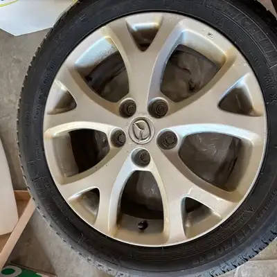 A SET OF 4 ALLOY RIMS. MAZDA & ACURA (MY CAR) Selling my Acura in the fall, so no longer needed. OR...