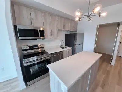 **NEW 1 BEDROOM + LARGE DEN + 2 FULL BATHS + PARKING/LOCKER