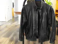 Leather motorcycle jacket - size men's small.