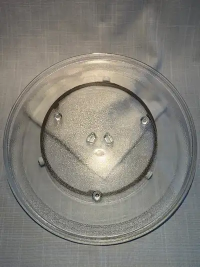 This microwave plate is in used condition. It is a turntable glass plate tray. It's perfect as a rep...