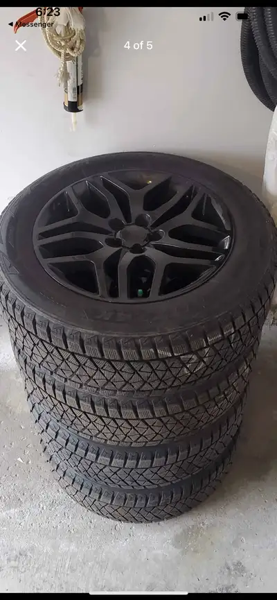 Great condition winter tires on rims Bridgestone Blizzak winter tires 235/60R18 107S Has most of the...