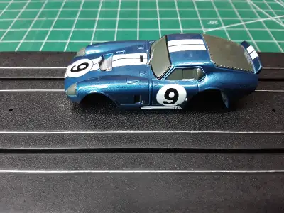 This is a rare and hard to find Tomy AFX Cobra Daytona Blue #9 HO slot car body. Brand new, never us...