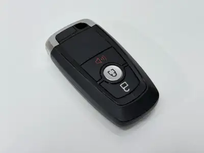 Genuine Ford OEM flip key fob with cut key included. In good used condition with working buttons and...