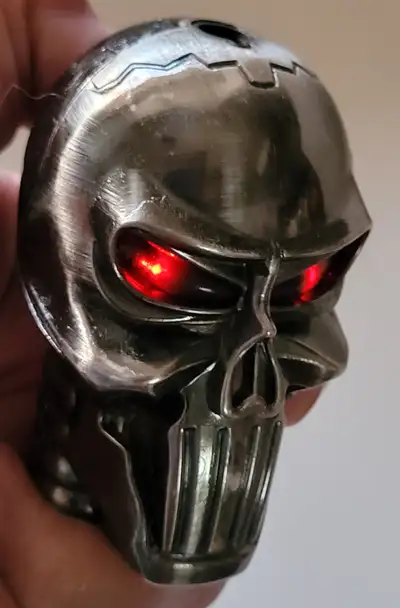 Slick Deluxe Metal Skull Shaped Lighter with Red eyes