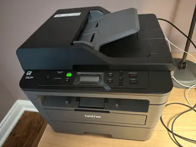 Like new Brother laser monochrome printer/scanner. Works great.
