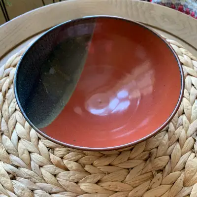 Signed studio redware pottery bowl, featuring a beautiful two-tone slip design. Lovely natural shade...
