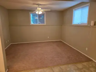 HERE'S WHAT WE HAVE FOR RENT: Spacious two bedroom basement suite. - MASSIVE WINDOWS AND LOTS OF NAT...
