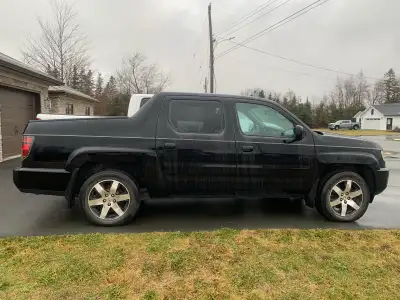 2014 Honda Ridgeline Special Edition See here for model details: ...