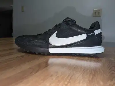 Elevate your game with the Nike Premier 3 Turf Low-Top Football Shoes, designed for the sport's afic...