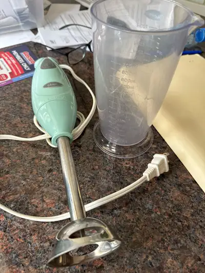 Simplify your kitchen prep with this reliable Oster immersion hand blender, perfect for soups, smoot...