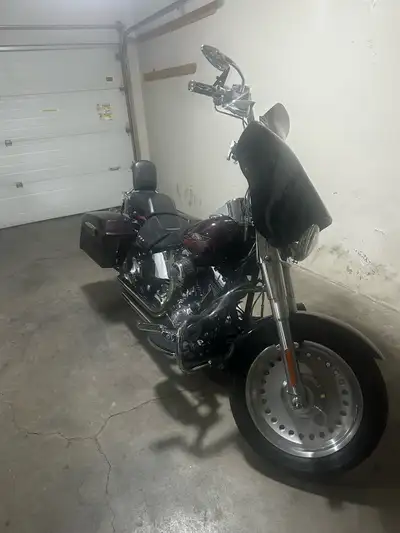 Absolutely mint 2007 Fatboy custom. Ape hangers Hard saddlebags and fairing Vance and Hines Shorty p...