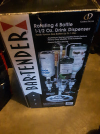 Rotating 4 bottle spinning bartender. New. $25
