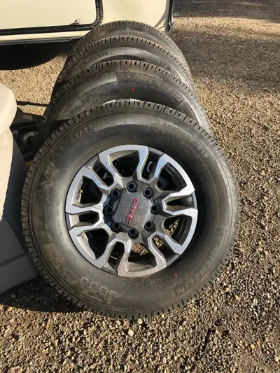 I'm selling a set of four GMC take-off tires and rims from a 2022 2500 HD AT4 LT275/70R18, these Mic...