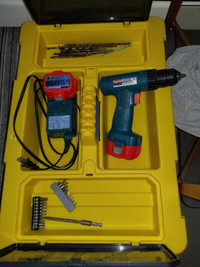 Cordless drill with Stanley tool caddy and some assorted bits