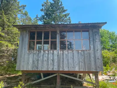 On the mountain with an ocean view, very private with 40' wide driveway entrance extending 150' with...
