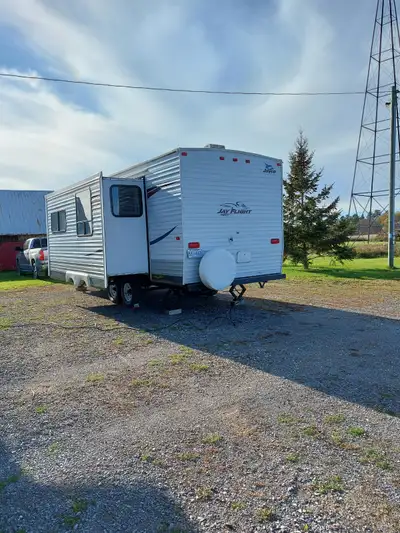2009 Jayco travel trailer, model 25BHS ( bunk house slide out ). Bed in the front, bunks in the back...