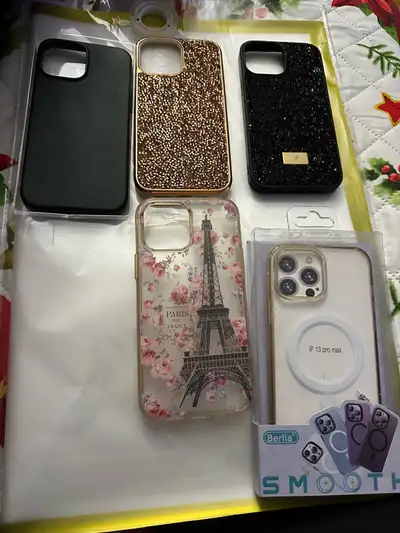 Five iPhone 13 Pro Max cases. Includes a black silicone case, two sparkly cases (one gold, one black...