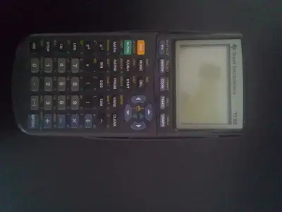 Texas Instruments TI-83 graphing calculator. Works great. $10obo or interesting trades.