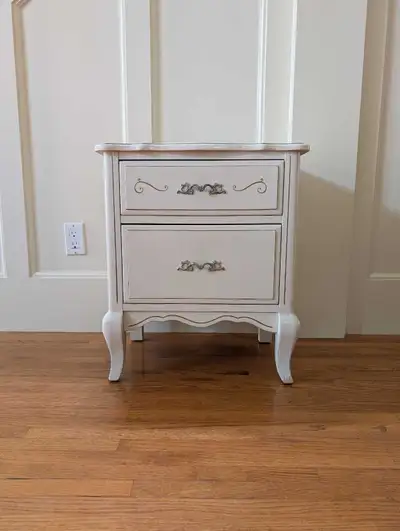 Quality actual all wood nightstand in a Victorian-inspired style, painted ivory colour. Uncertain of...