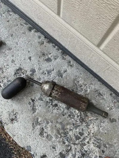 This is a collectible, not a working tool. It is an antique grease gun / vacuum tool for old cars. P...
