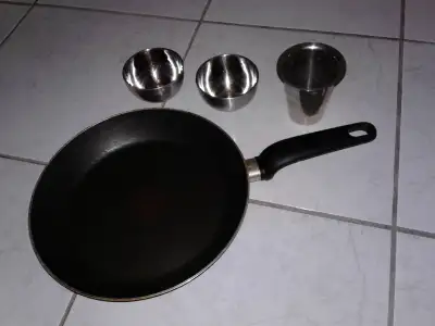 T-Fal frying pan with 3 stainless steel cups $8, View more