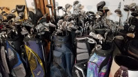 Several golf club sets, bags, irons, etc.
