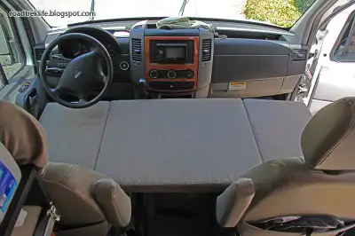 never used, folding bed for Mercedes Sprinter. Goes on the front seats and makes an additional sleep...