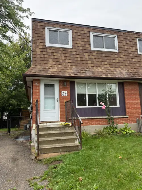Three bedroom two-story home with one and a half bathrooms, walk out to a privacy fenced deck, fence...