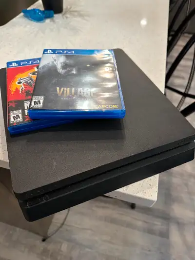 Playstation 4 (PS4) + 2 Games Includes: Resident Evil Village Red Dead Redemption 2 PS4 Power Cable