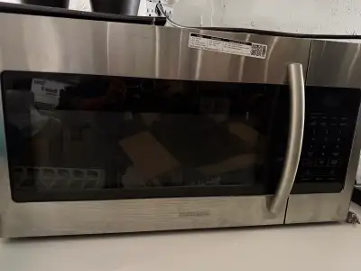 Offering a used Samsung over-the-range microwave with 1000W power output. This stainless steel micro...