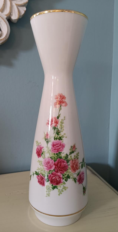 This tall trumpet shaped porcelain vase from PMR Jaeger & Co in Bavaria, Germany features a pink ros...