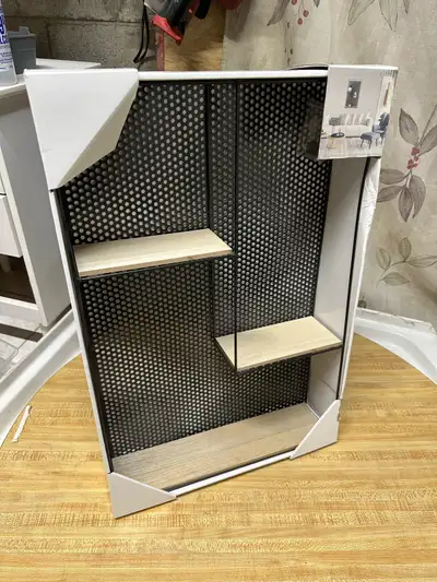 Black metal frame with light wood shelves. Three shelves total. New in box.