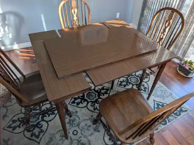Kitchen table, and four large chairs. Extension board included., View more
