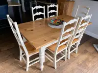 Dining table with 6 chairs and two extensions. 