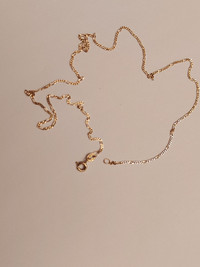 Yellow gold delicate chain 14K.. stamped  585. 15.5 inches..
