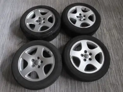 A set of 4 Audi 7JX16H2ET45 aluminum rims and Continental Conti Touring Contact 91H CH95 205/55R16 t...