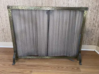 Hardly used fireplace screen. Retracrable