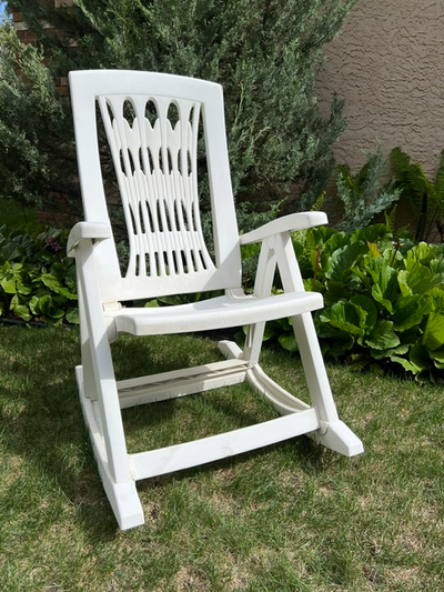 Kick back, relax, rock and recline on your patio or deck with this white rocking chair. - Features:...