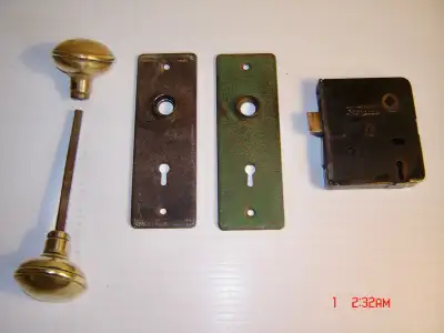 This is a beautiful antique door lock set consisting of the lock mechanism, the door plates and the...